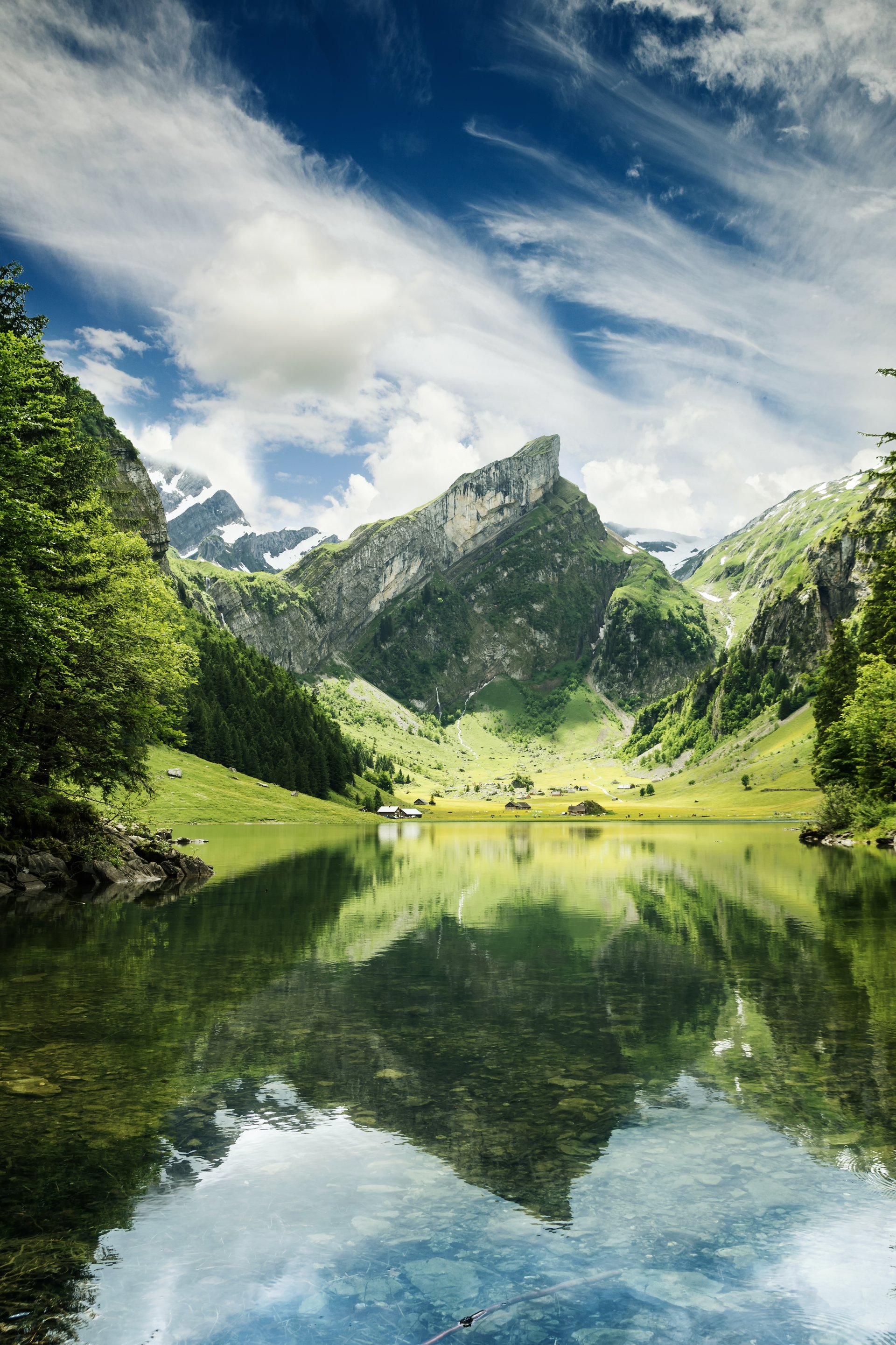 Tranquil scene of seealpsee lake reflecting the mountain of Alpstein, Appenzell, Switzerland